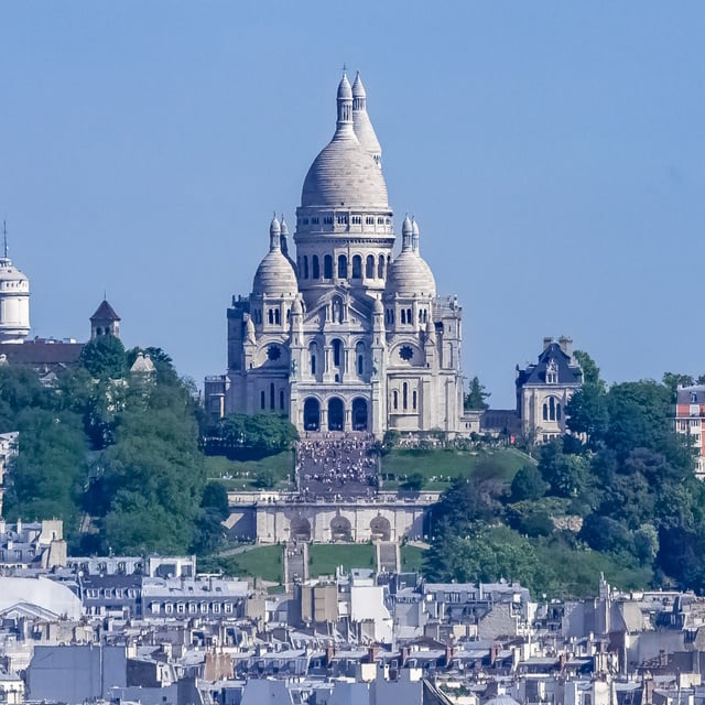 Paris, panorama of the city, typical roofs and buildings, with M