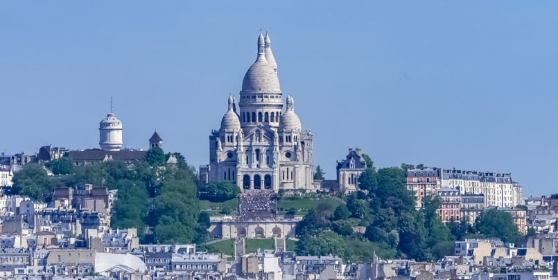 Paris, panorama of the city, typical roofs and buildings, with M